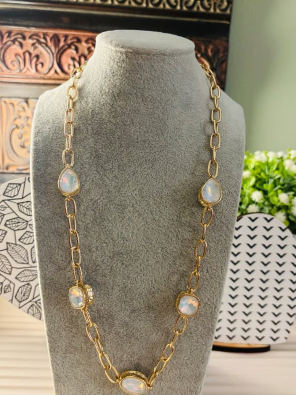 Gold tone chain necklace with opal-like stones